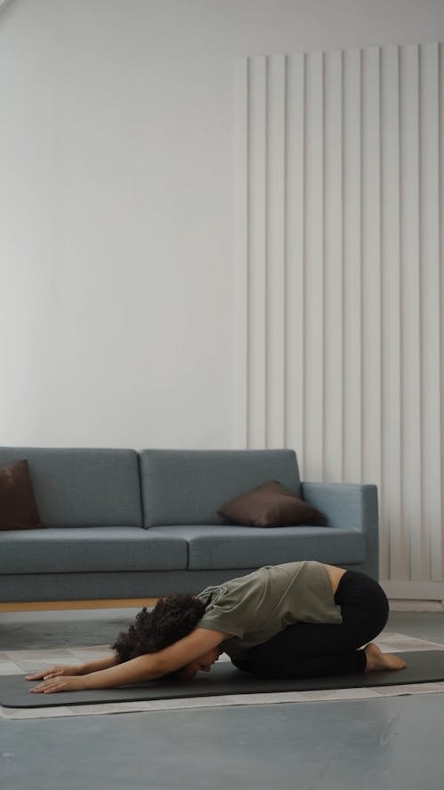 A Woman Exercising At Home