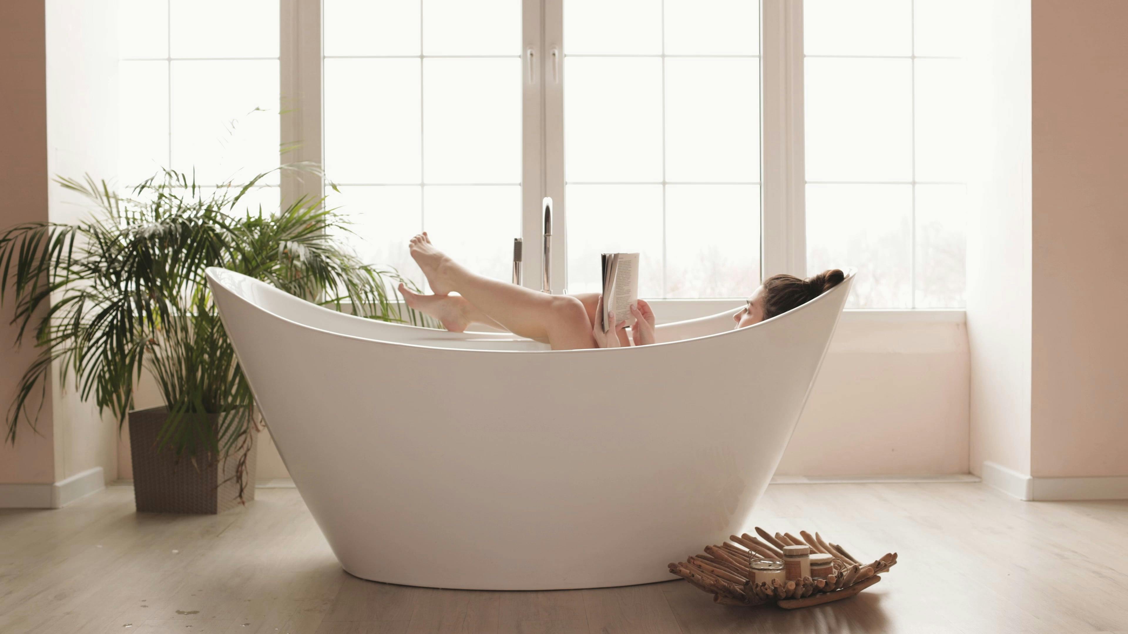 Woman in Bathtub Reading a Book · Free Stock Video