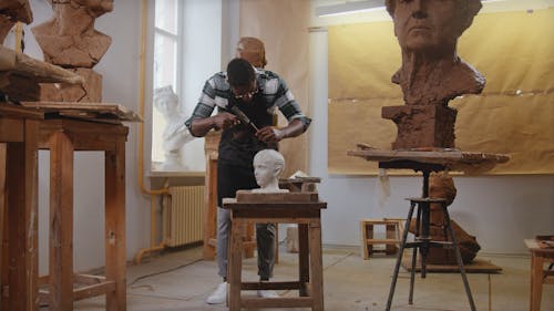 Man Working on a Sculpture