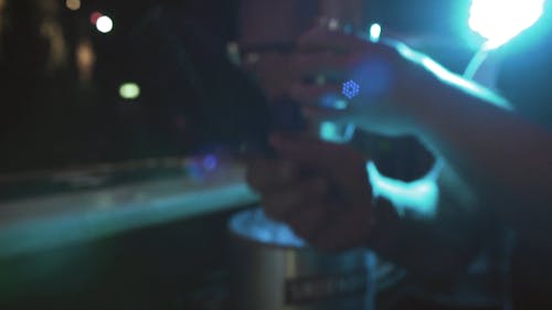 A Bartender Putting Ice to a Cocktail Shaker