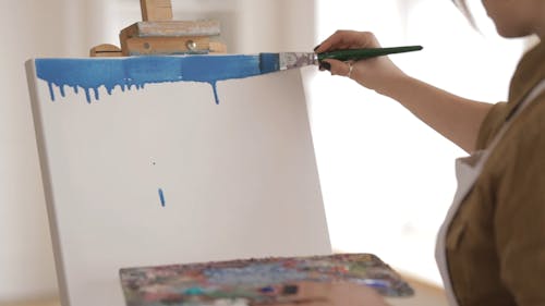 Woman Painting In A White Board