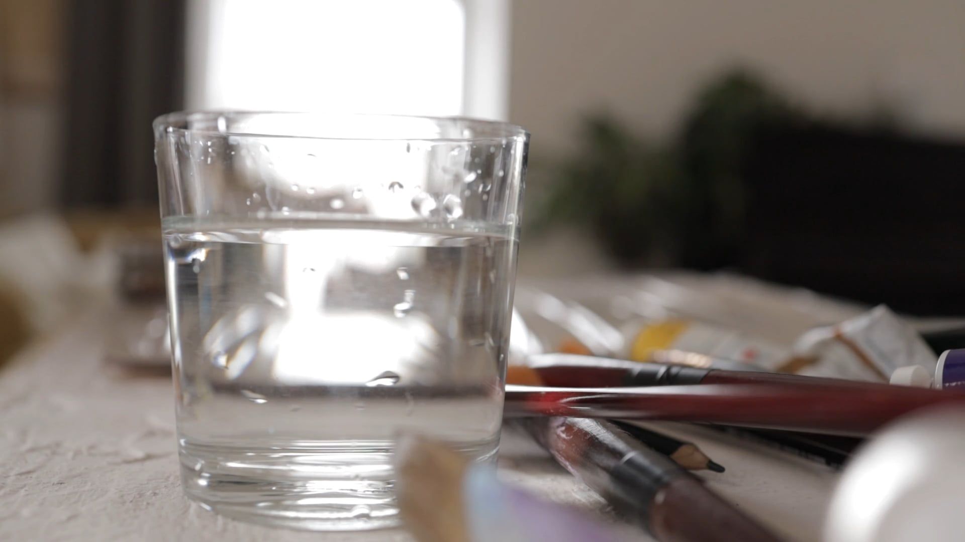 Dipping A Paint Brush With Ink In The Glass Of Water Free Stock Video dipping-a-paint-brush-with-ink-in-the-glass-of-water-free-stock-video