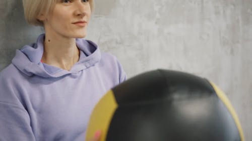 A Woman Exercising Using An Exercise Ball