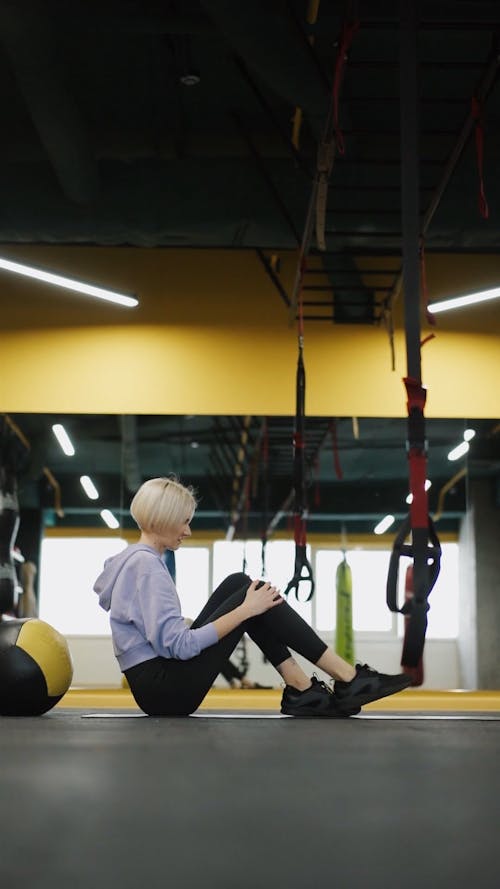 A Woman Exercising On The Gym Floor