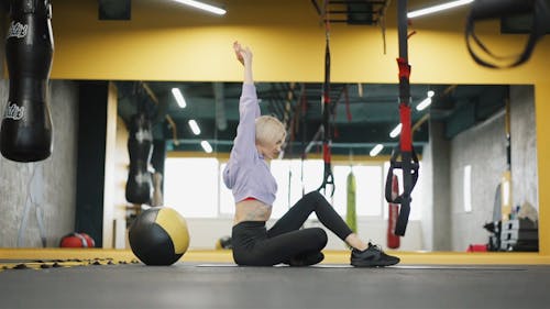 A Woman Exercising On The Gym Floor