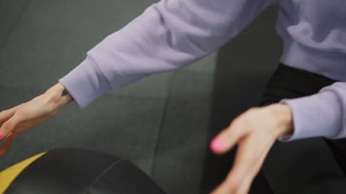 A Woman Exercising With An Exercise Ball