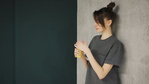 A Woman Drinking A Health Drink