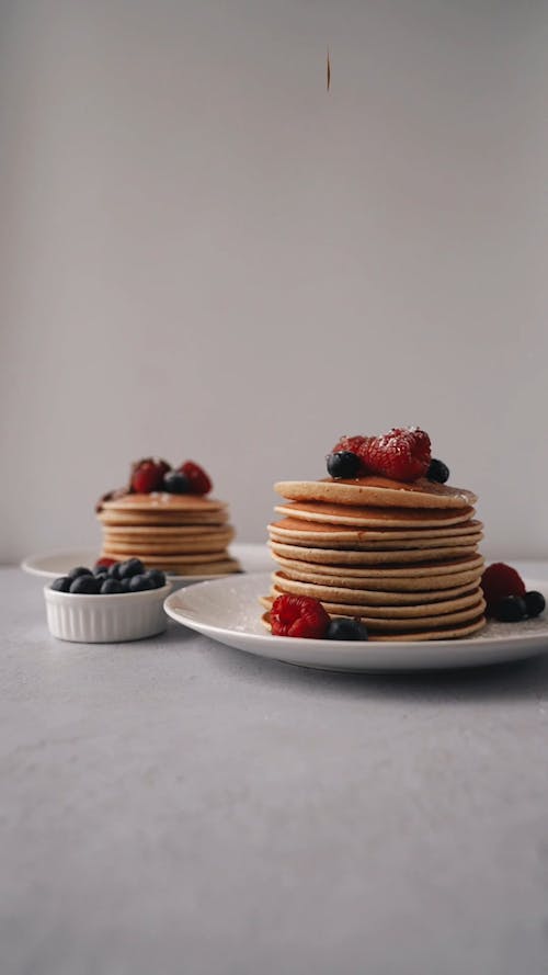 Pancakes with Berries and Chocolate Syrup