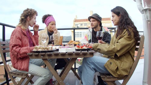 Friends Getting Food and Wines in a Terrace