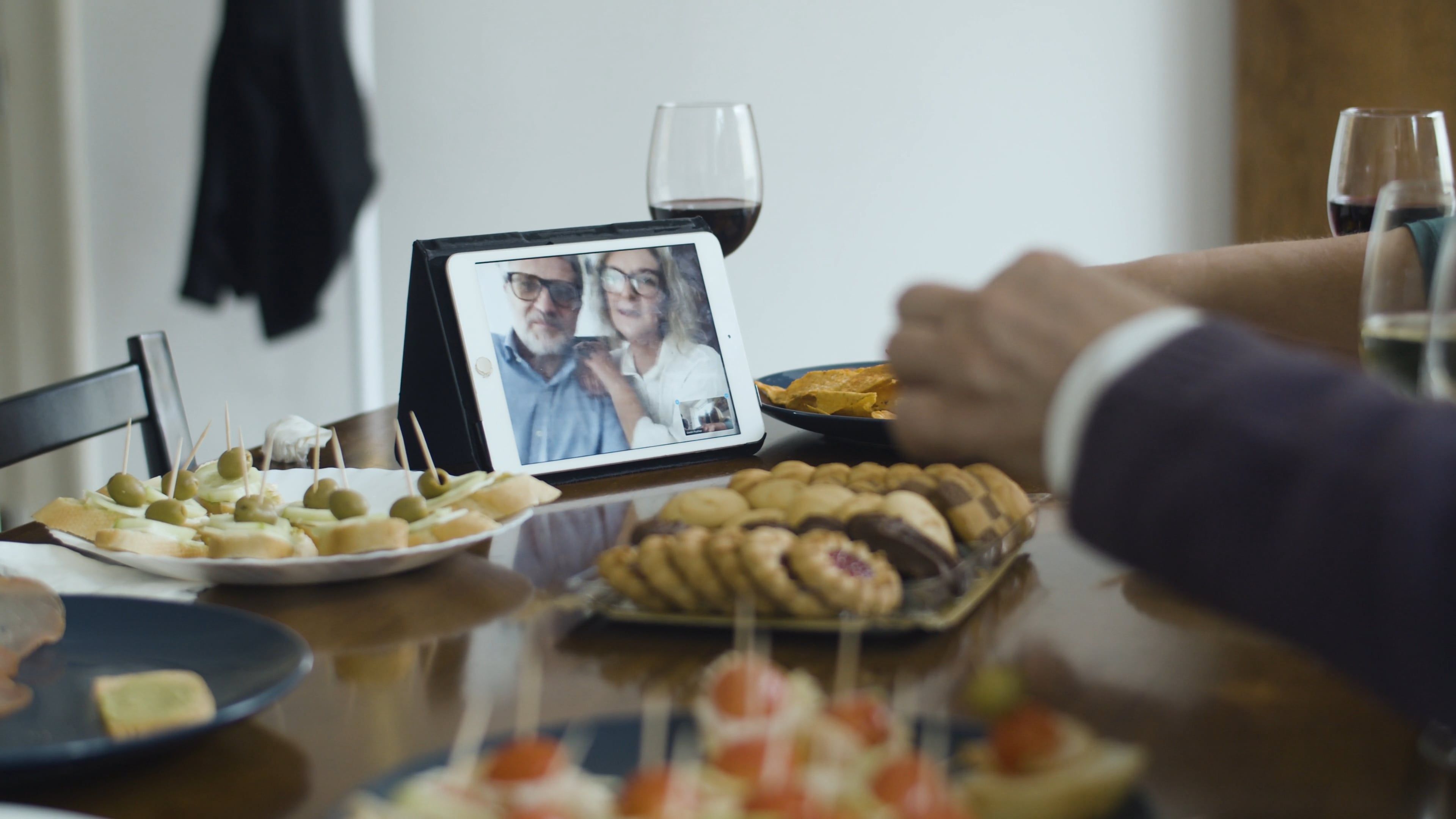 Person Eating While on a Video Call with an Elderly Couope Free Stock ...