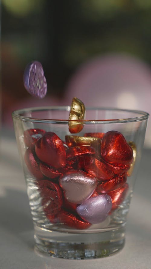 Close-Up View of Heart-Shaped Chocolates on a Glass