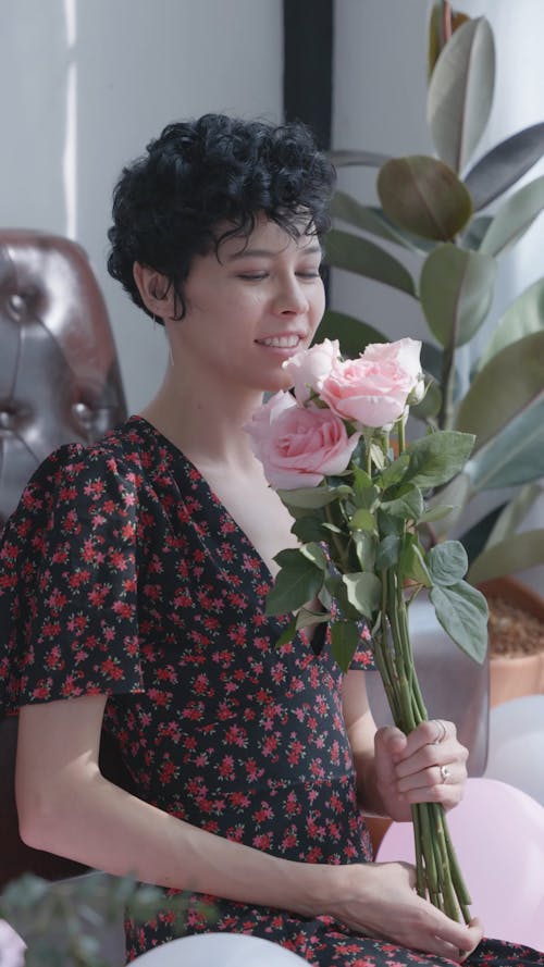 Woman Holding Pink Roses