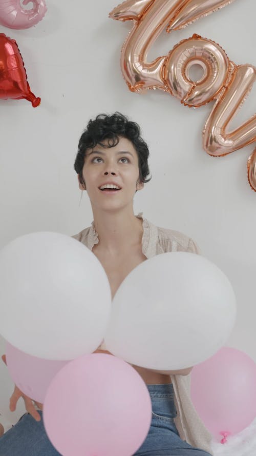 Woman Playing With Balloons