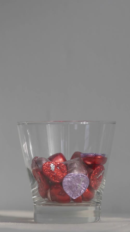 Close-Up View of Heart-Shaped Chocolates on a Glass
