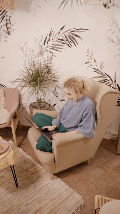 Woman Sitting Using Her Laptop