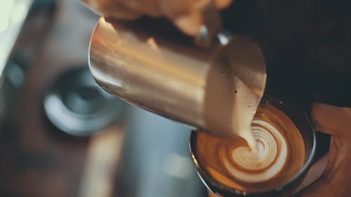 A Person Making a Coffee Art