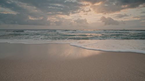 Waves Hitting The Beach Shore