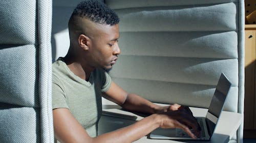 A Man Working With a Laptop