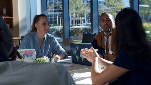 A Group Of People In A Business Meeting