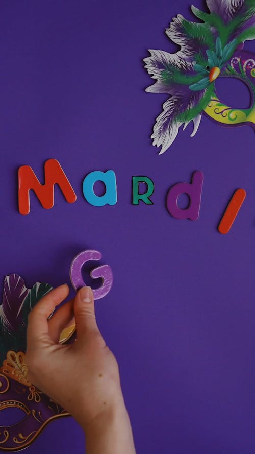 Mardi Grass Text And Masks On Purple Background