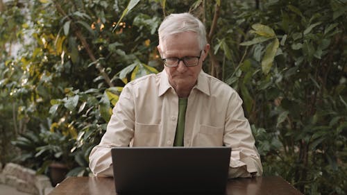 Man Busy Using His Laptop