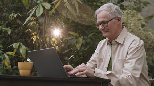 Man Busy Using His Laptop