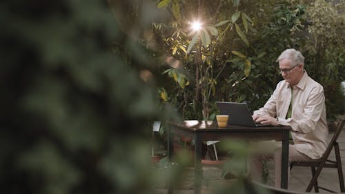 Man Busy Using His Laptop