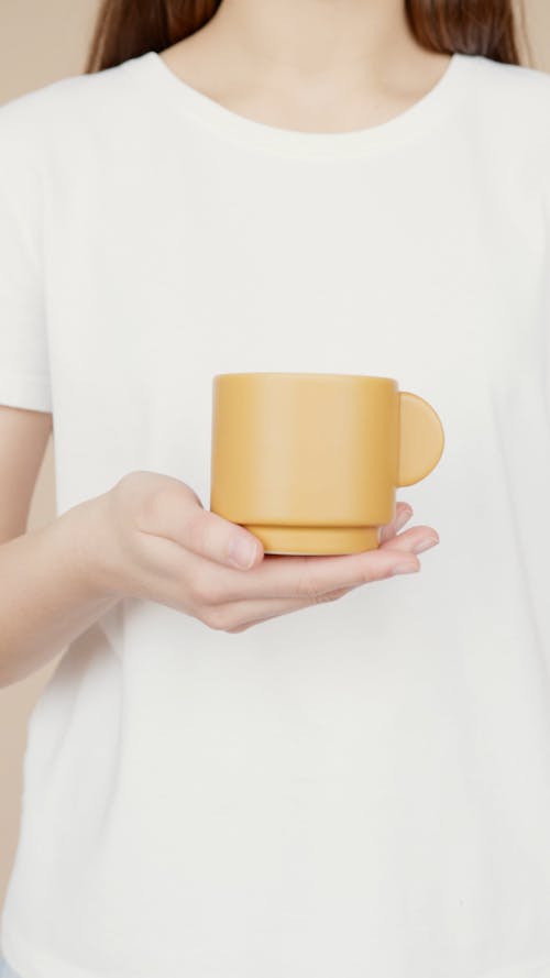 Woman Holding a Mug