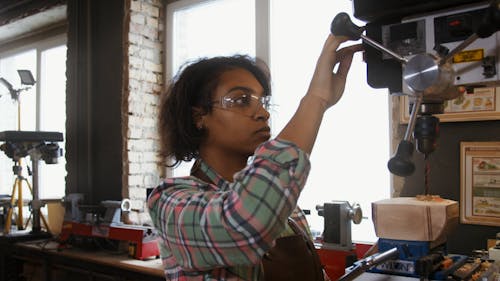 Young Woman Benchtop Drill Press