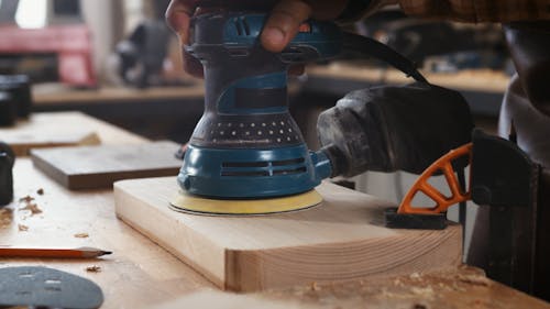 Carpenter Working on a Wood Piece 