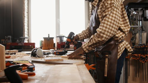 Man Drilling Wood