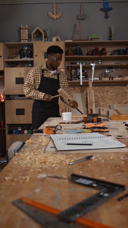 A Man using Chisel and Hammer