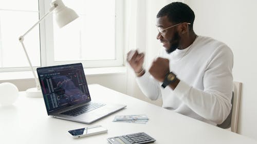 Video Of Man Looking Happily In Front Of His Laptop