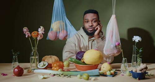 Man Taking a Bite of Apple