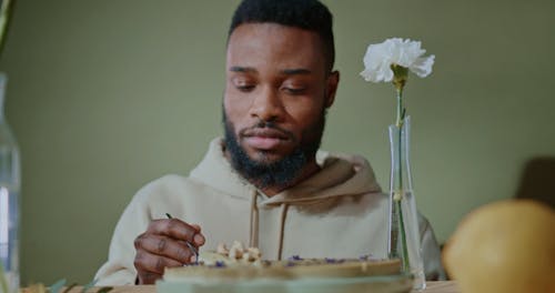 Man Looking at the Cake