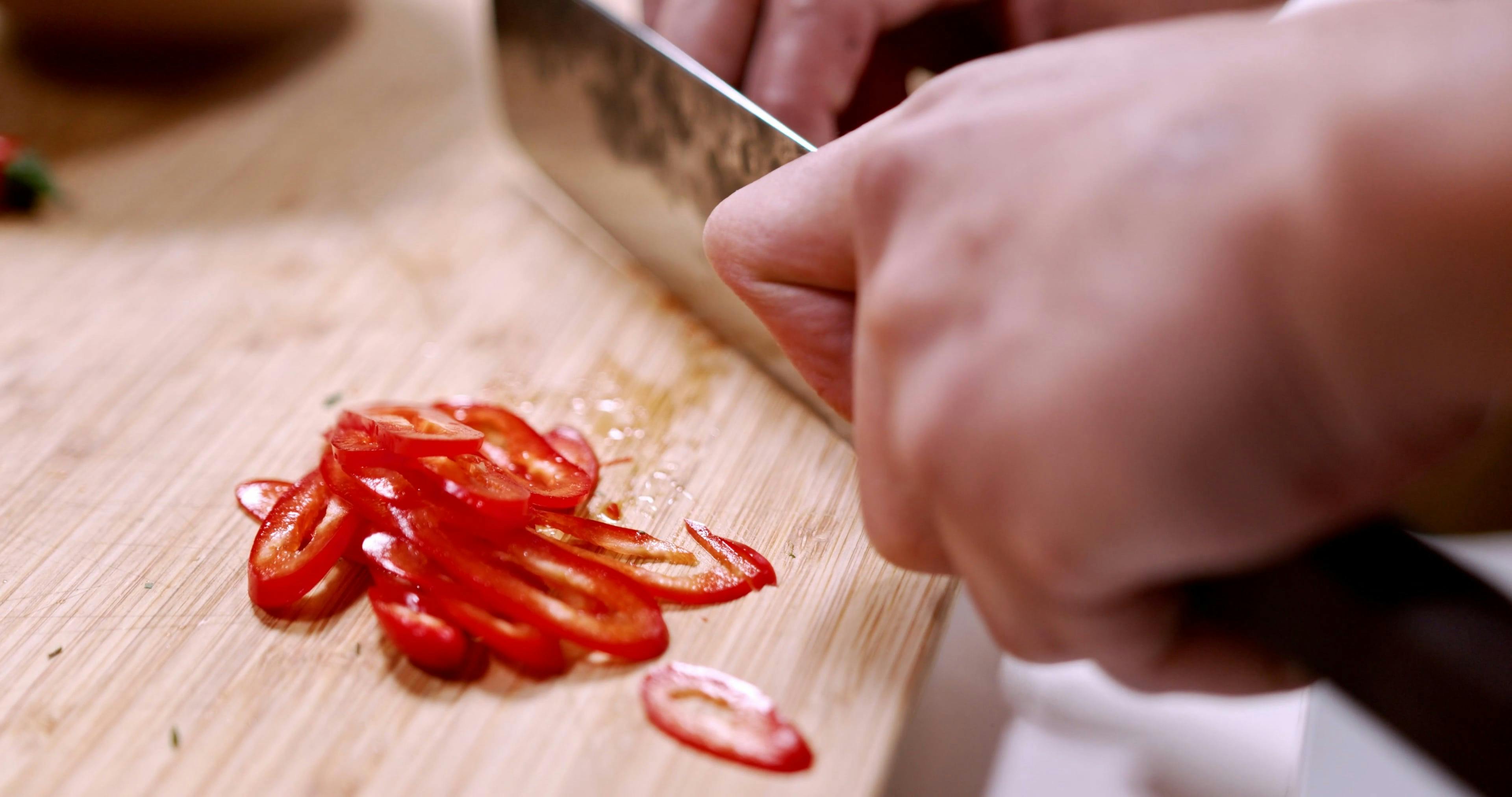 Person Cutting Chili Pepper Free Stock Video Footage, RoyaltyFree 4K