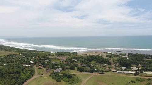 Aerial Footage Of Waves Hitting The Beach Shore