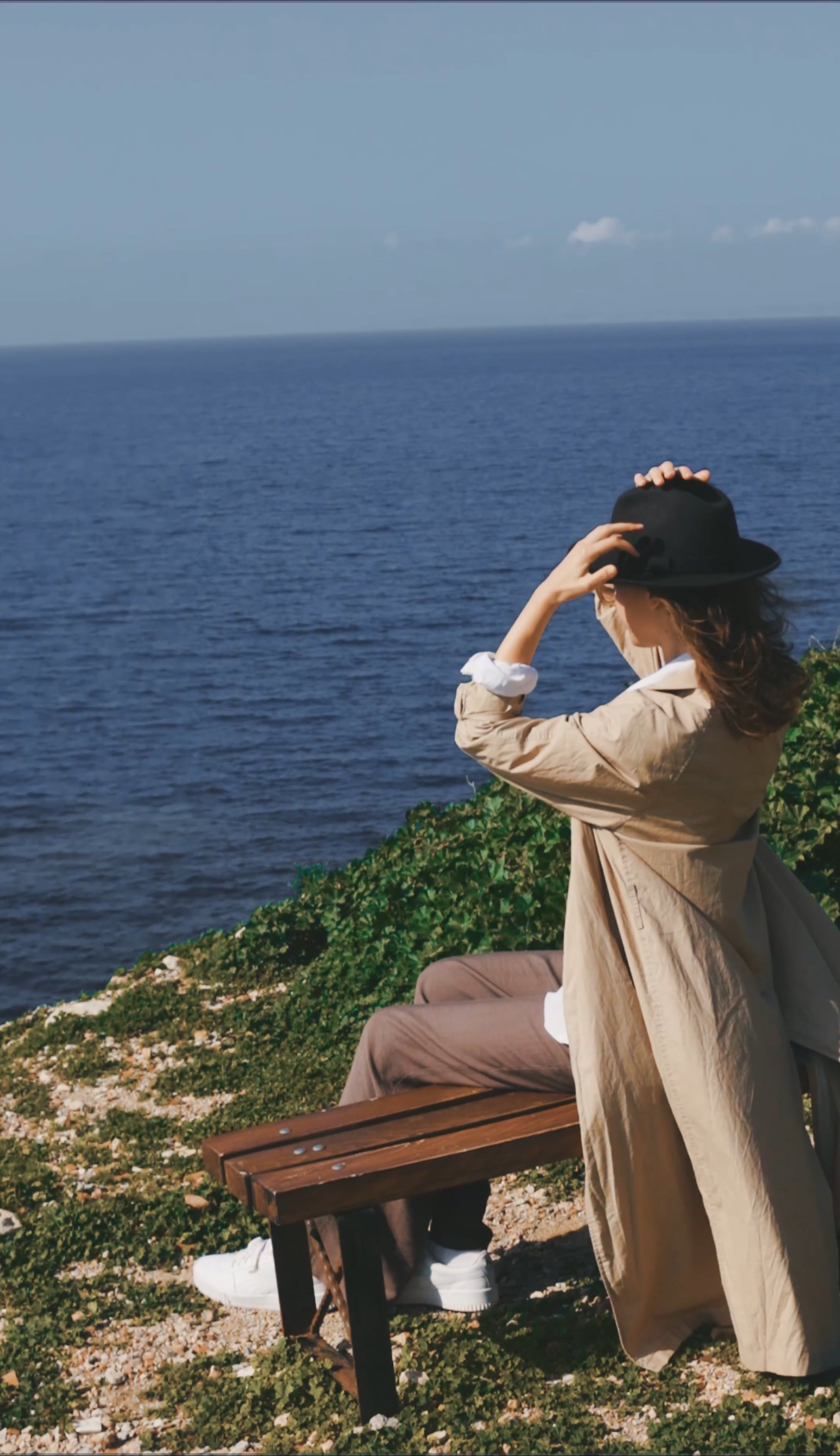 A Woman Sitting on the Bench while Looking at the Ocean View Free Stock ...