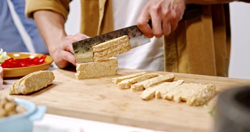 Chef Hands Slicing Tempeh 
