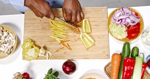 Man Chopping Bell Pepper