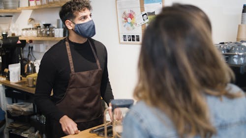 A Man Working as a Barista