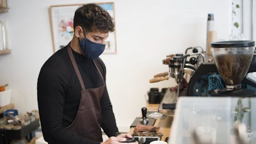 A Customer Getting Her Coffee