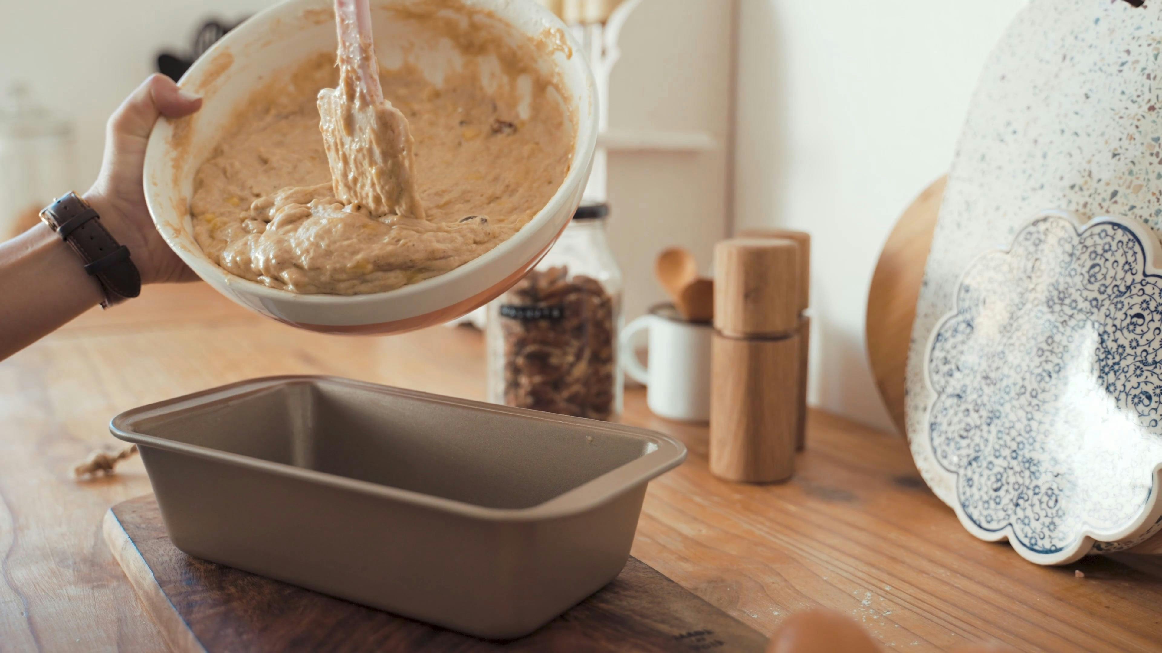 Putting Batter into Baking Pan · Free Stock Video
