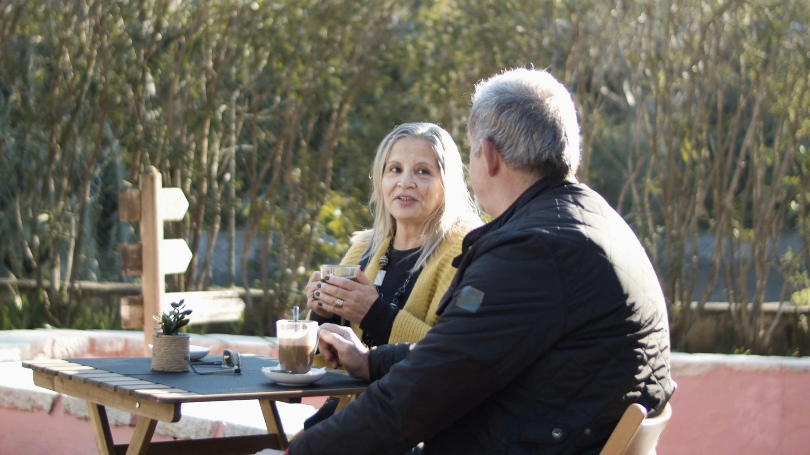 Couple Talking While Sitting Outdoor · Free Stock Video