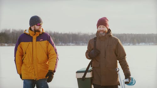 Fishers Walking in a Frozen Lake 