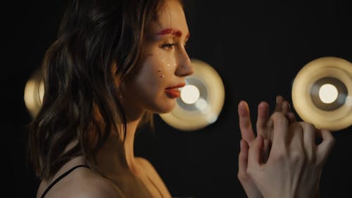 Close up of Women with Shiny Makeup Holding Hands