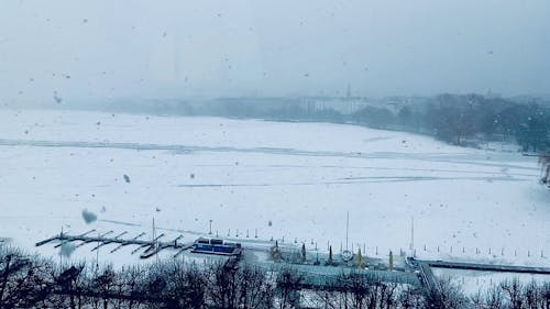 Snowfall on a Frozen Lake