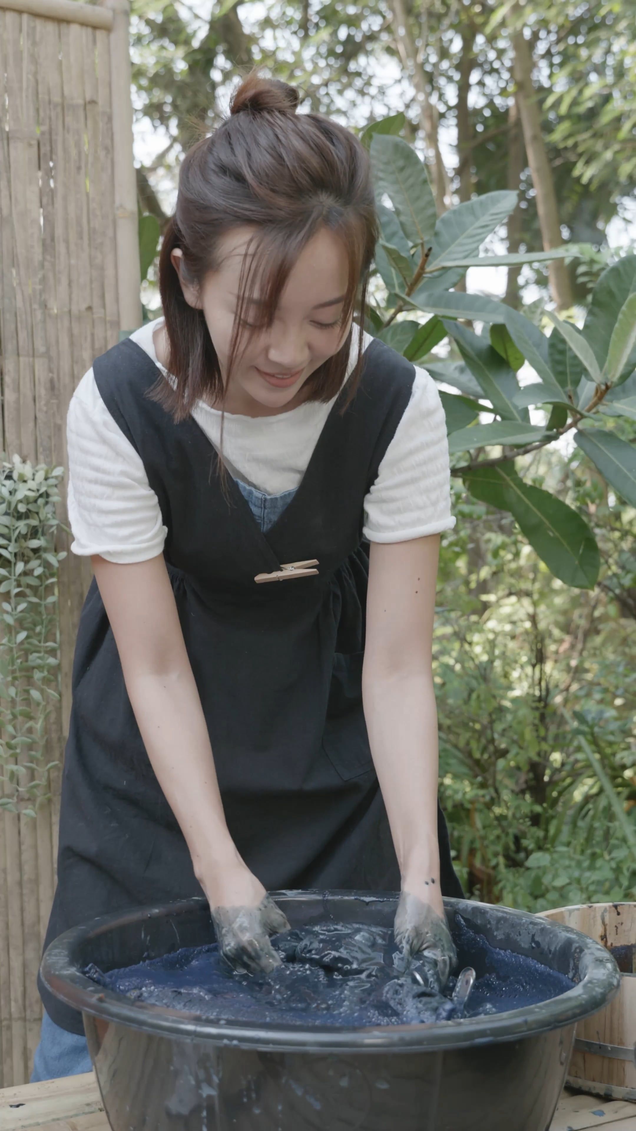 A Woman Soaking Fabrics into a Dye Bath Free Stock Video Footage