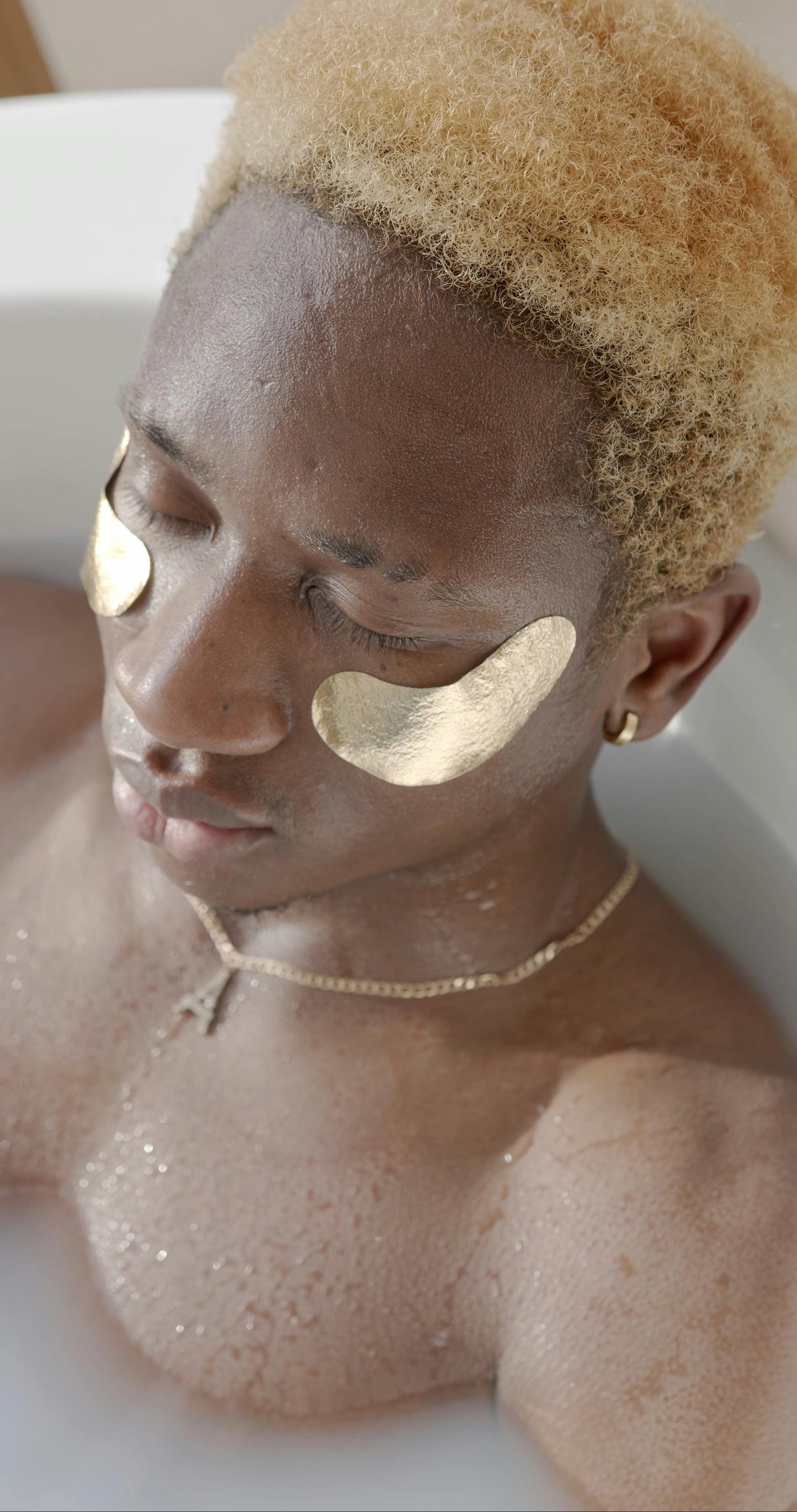 Man Bathing on a Bathtub and Applied Under Eye Patches Free Stock Video
