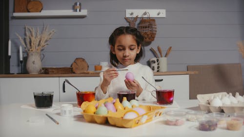 A Girl Decorating Easter Eggs